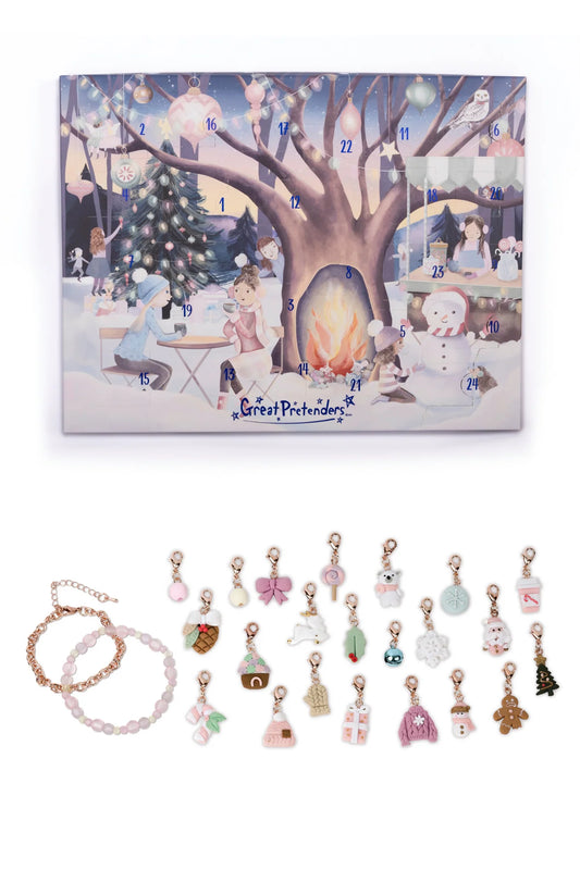 Advent calendar with Christmas scene and small charms displayed below.