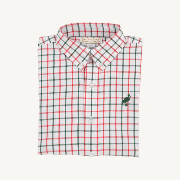 Folded checkered shirt with a small logo on a white background