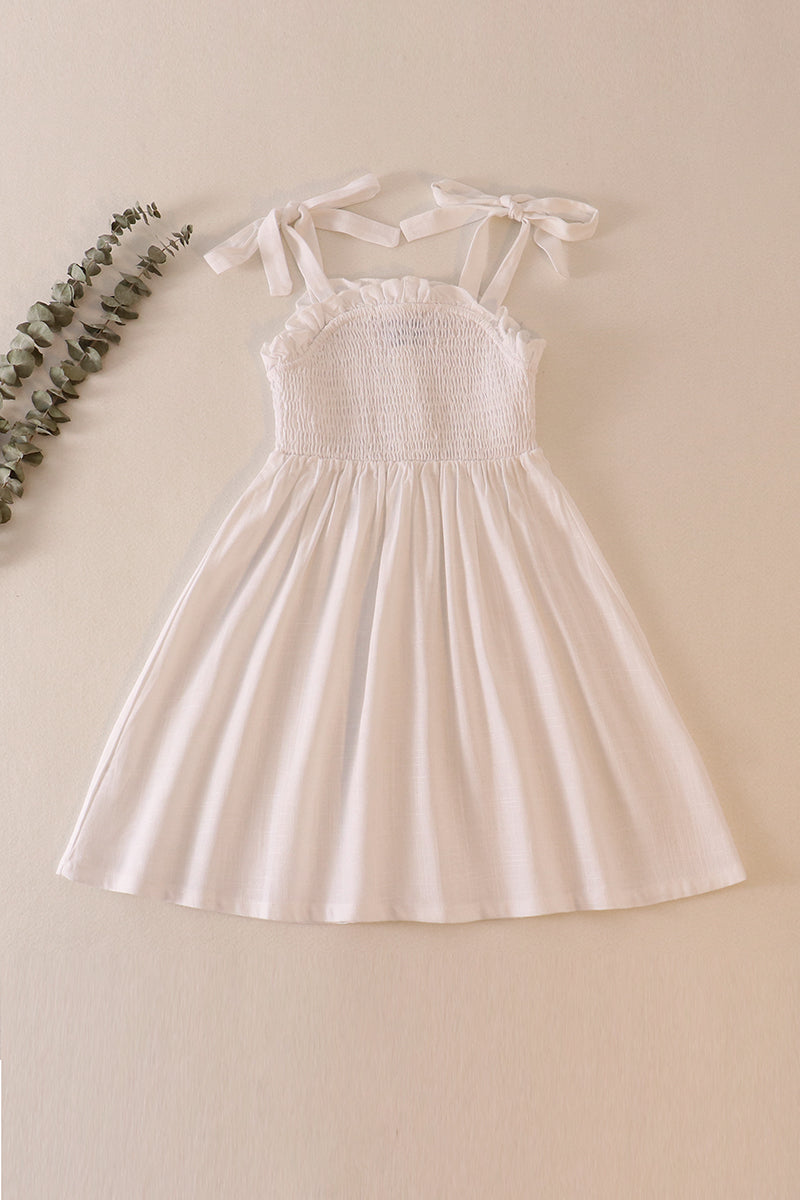 White linen smocked button dress