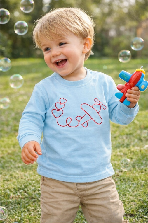 Little boy in airplane tshirt
