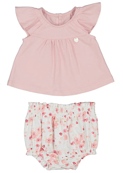 Pink top and floral bloomers set on a white background