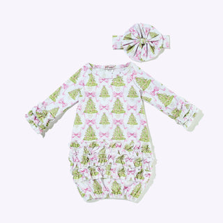 Pink baby gown with pine tree and bow pattern, featuring ruffles and a matching headband.