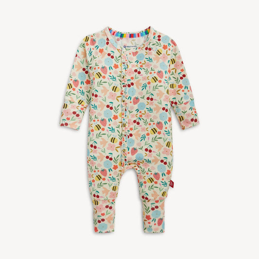 Floral patterned baby onesie on a plain background