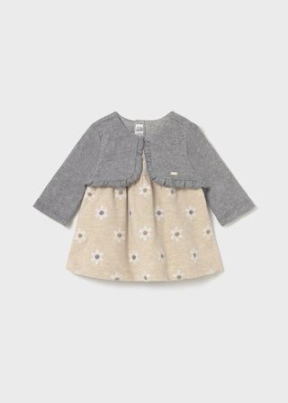 Baby dress with gray cardigan on a light gray background