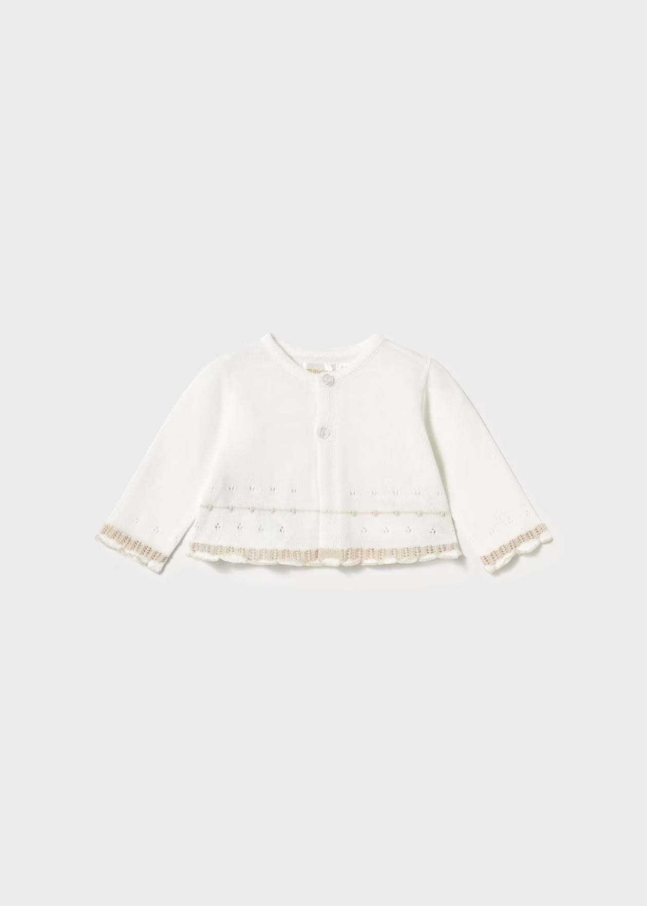 White baby jacket with lace trim on a light gray background