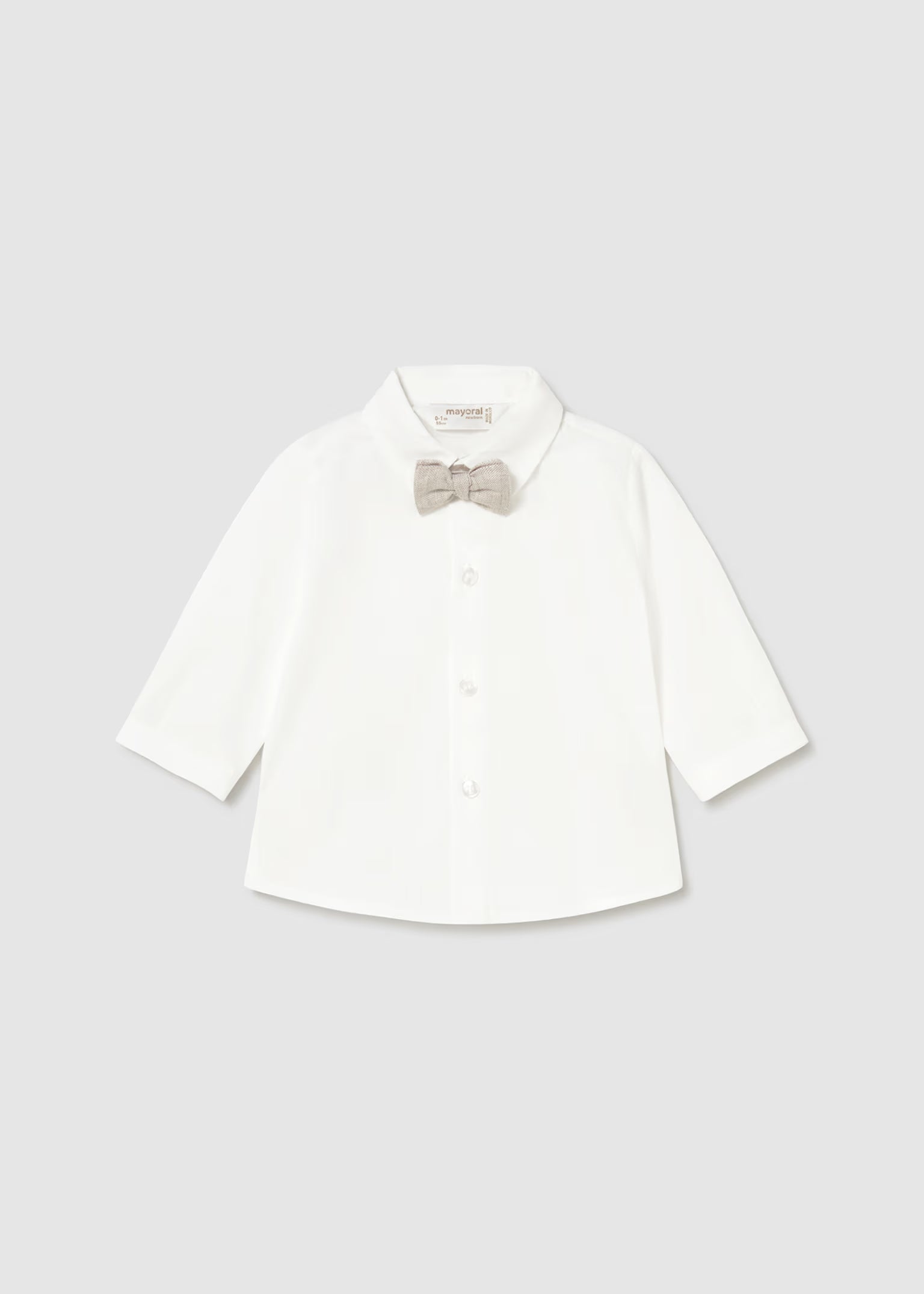 White dress shirt with a bow tie on a light gray background
