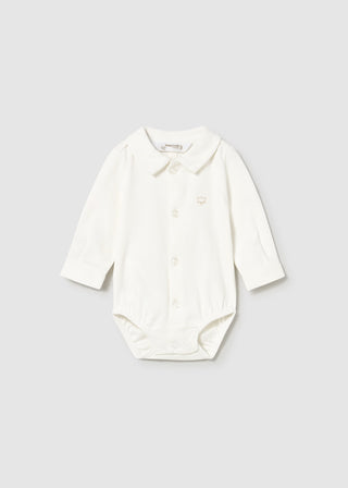 White baby bodysuit with buttons on a light gray background