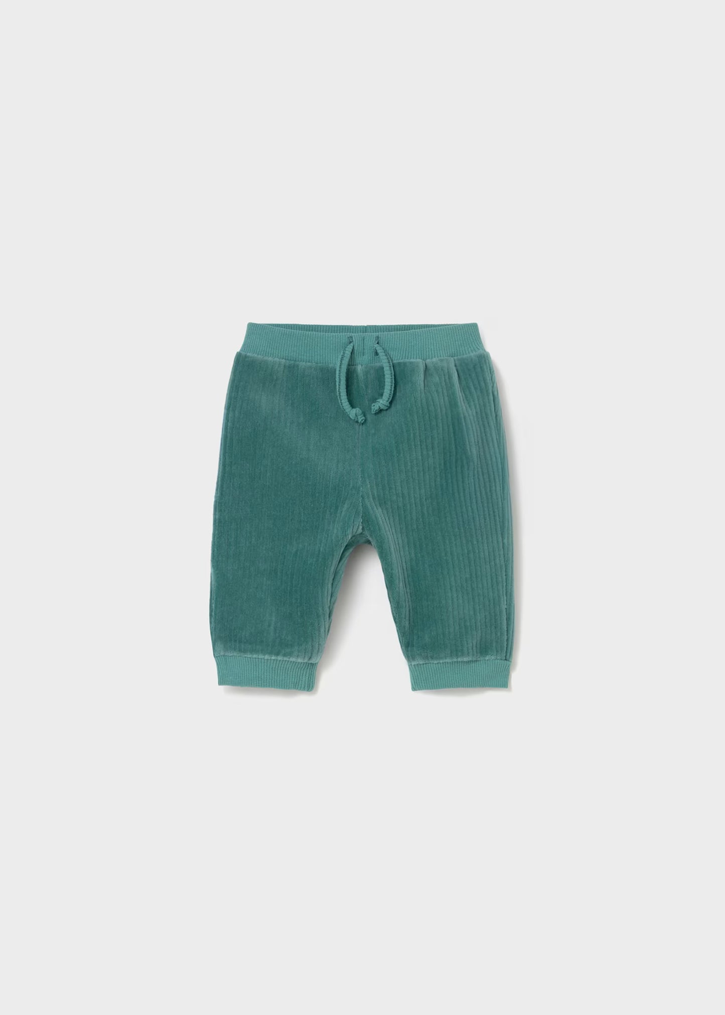 Green baby pants with a drawstring on a light gray background