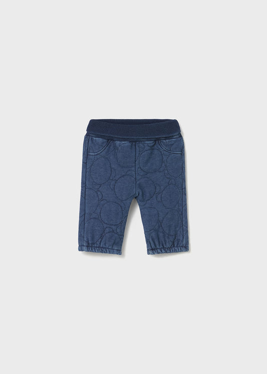 Blue children's pants on a light gray background