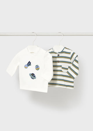 Two children's polo shirts on hangers against a white background